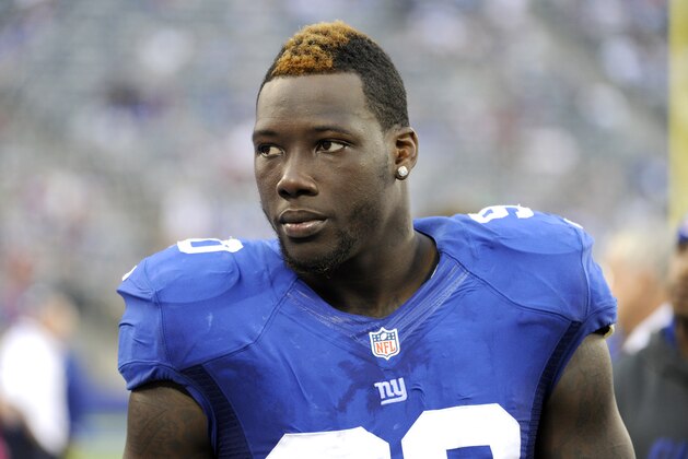 New York Giants' Jason Pierre-Paul looks on during the second half of an NFL football game against the Philadelphia Eagles Sunday, Oct. 6, 2013, in East Rutherford, N.J. The Eagles won the game 36-21. (AP Photo/Bill Kostroun)