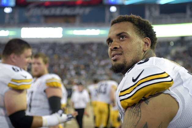 Pittsburgh Steelers center Maurkice Pouncey, right, watches from the bench during the first half of an NFL preseason football game against the Jacksonville Jaguars in Jacksonville, Fla., Friday, Aug. 14, 2015. (AP Photo/Phelan M. Ebenhack)