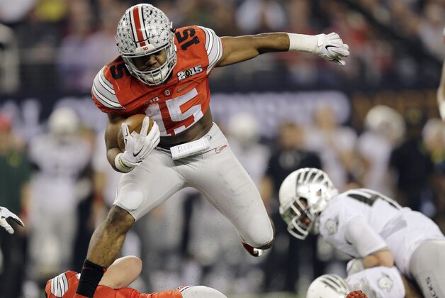 FILE - In this Jan. 12, 2015, file photo, Ohio State's Ezekiel Elliott runs during the first half of the NCAA college football playoff championship game against Oregon in Arlington, Texas. Elliott and the Ohio State offensive line could make most quarterbacks look good. For all the headlines generated by the Buckeyes' ability to replace a star quarterback with another star quarterback last season, the development of running game was every bit as important to Ohio State's national championship season.  (AP Photo/Eric Gay, File)