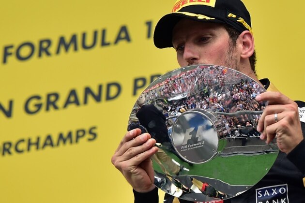 Third-placed Lotus F1 Team's French driver Romain Grosjean celebrates with his trophy  on the podium at the Spa-Francorchamps circuit in Spa on August 23, 2015, after the Belgian Formula One Grand Prix. AFP PHOTO / ANDREJ ISAKOVIC        (Photo credit should read ANDREJ ISAKOVIC/AFP/Getty Images)