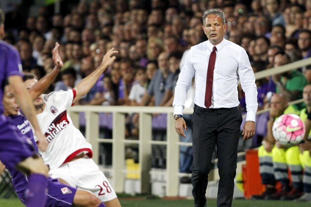 AC Milan coach Sinisa Mihajlovic, right, watches a Serie A soccer match between AC Milan and Fiorentina, at the Artemio Franchi stadium in Florence, Italy, Sunday, Aug. 23  2015. (AP Photo/Fabrizio Giovannozzi)