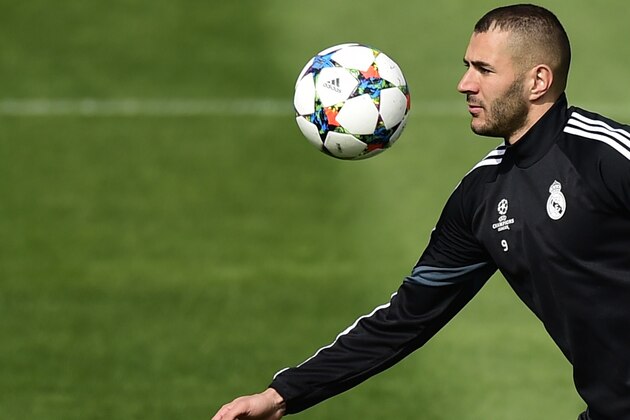 Real Madrid's French forward Karim Benzema trains at Valdebebas Sport City in Madrid on April 13, 2015 on the eve of their UEFA Champions League quarter final first leg football match against Atletico de Madrid. AFP PHOTO/ PIERRE-PHILIPPE MARCOU        (Photo credit should read PIERRE-PHILIPPE MARCOU/AFP/Getty Images)