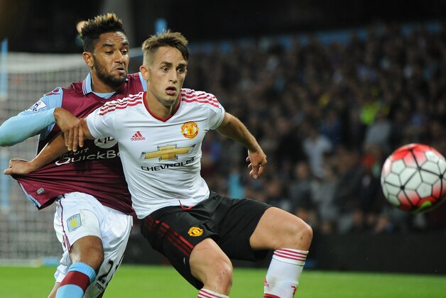 Aston Villa’s Jordan Amavi, left, contest the ball with Manchester United’s Adnan Januzaj during the English Premier League soccer match between Aston Villa and Manchester United at Villa Park, Birmingham, England, Friday, Aug. 14, 2015. (AP Photo/Rui Vieira)