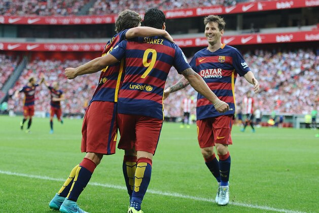 BILBAO, SPAIN - AUGUST 23:  Luis Suarez of FC Barcelona celebrates with Lionel Messi and Sergi Roberto after scoring Barcelona opening goal during the La Liga match between Athletic Club and FC Barcelona at San Mames Stadium on August 23, 2015 in Bilbao, Spain.  (Photo by Denis Doyle/Getty Images)