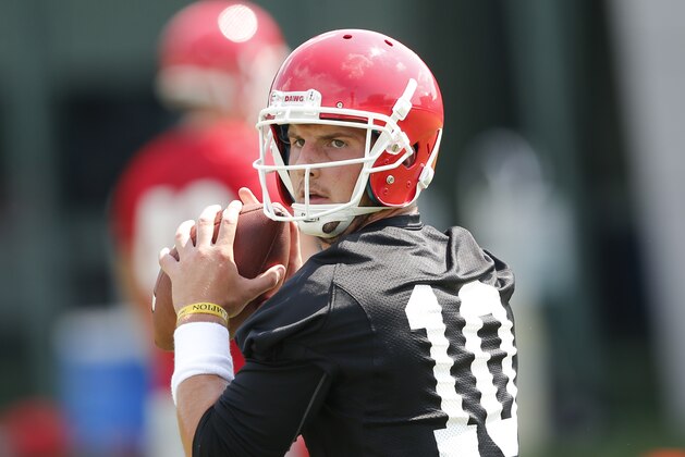 Georgia Bulldogs quarterback Faton Bauta (10) throws during a college football practice Tuesday, Aug. 4, 2015, in Athens, Ga. (AP Photo/John Bazemore)