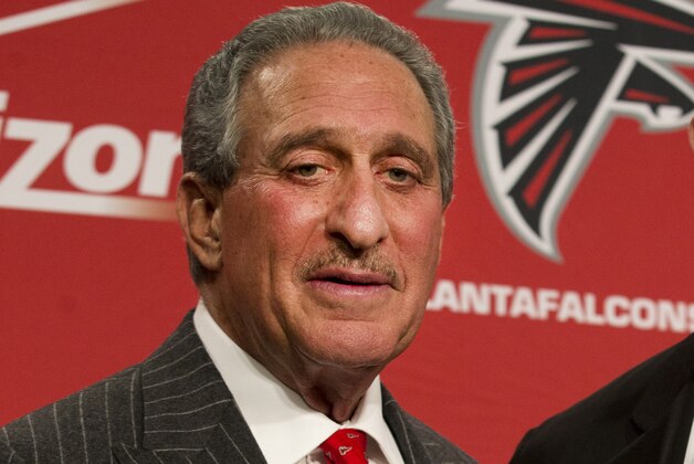 FILE - In this Feb. 3, 2015, file photo, Atlanta Falcons owner Arthur Blank poses after  a news conference in Flowery Branch, Ga. Blank says there is a