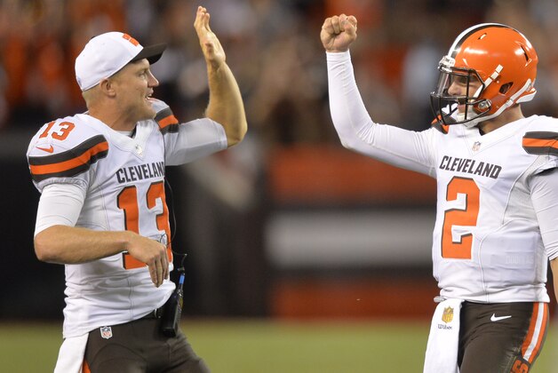 Cleveland Browns quarterback Josh McCown (13) congratulates Johnny Manziel (2) after Manziel threw a 21-yard touchdown pass to Shane Wynn in the fourth quarter of an NFL preseason football game against the Buffalo Bills Thursday, Aug. 20, 2015, in Cleveland.  Buffalo won 11-10. (AP Photo/David Richard)