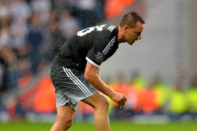 WEST BROMWICH, ENGLAND - AUGUST 23:  John Terry of Chelsea takes out his shin pads on his walk off the pitch after he is sent off during the Barclays Premier League match between West Bromwich Albion and Chelsea on August 23, 2015 in West Bromwich, United Kingdom.  (Photo by Adam Fradgley - AMA/Getty Images)