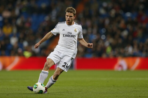 Real's Asier Illarramendi controls the ball during a Copa del Rey soccer match between Real Madrid and third-division club Xativa Olimpic at the Bernabeu stadium in Madrid, Wednesday Dec. 2013. (AP Photo/Paul White)