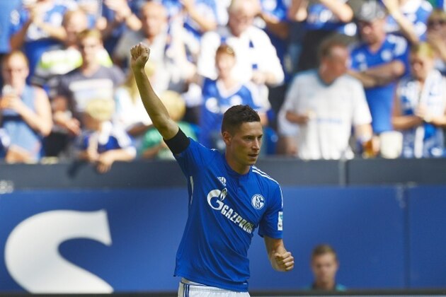 Schalke's midfielder Julian Draxler celebrates scoring the 1-1 goal during the German first division Bundesliga football match FC Schalke 04 v SV Darmstadt 98, on August 22, 2015 in Gelsenkirchen, western Germany.   AFP PHOTO / SASCHA SCHUERMANN
RESTRICTIONS: DURING MATCH TIME: DFL RULES TO LIMIT THE ONLINE USAGE TO 15 PICTURES PER MATCH AND FORBID IMAGE SEQUENCES TO SIMULATE VIDEO. 
== RESTRICTED TO EDITORIAL USE == FOR FURTHER QUERIES PLEASE CONTACT DFL DIRECTLY AT + 49 69 650050.        (Photo credit should read SASCHA SCHUERMANN/AFP/Getty Images)