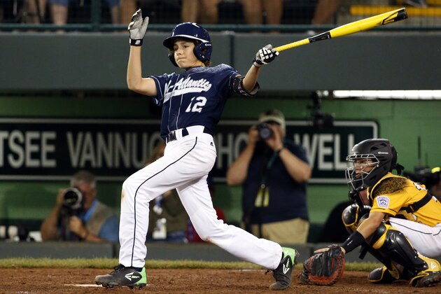 Lewisberry, Pennsylvania's Jaden Henline hits a walk-off, three-run double, off Taylors, South Carolina's Ryan Soug during the sixth inning of a baseball game in United States pool play at the Little League World Series tournament in South Williamsport, Pa., Sunday, Aug. 23, 2015. Lewisberry, Pennsylvania won 9-8. (AP Photo/Gene J. Puskar)