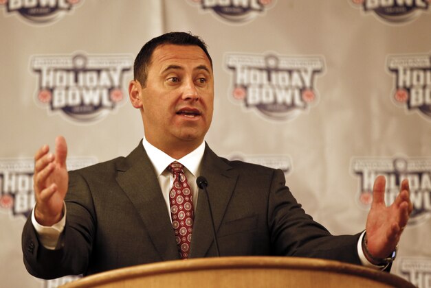 Southern California head coach Steve Sarkisian answers questions during a news conference, Friday, Dec. 26, 2014, in San Diego. USC takes on Nebraska in the Holiday Bowl on Saturday. (AP Photo/Lenny Ignelzi)