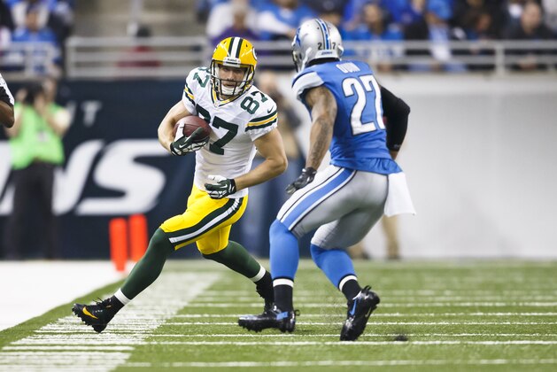Green Bay Packers wide receiver Jordy Nelson (87) runs the ball defended by Detroit Lions strong safety Glover Quin (27) during an NFL football game at Ford Field in Detroit, Thursday, Nov. 28, 2013. (AP Photo/Rick Osentoski)