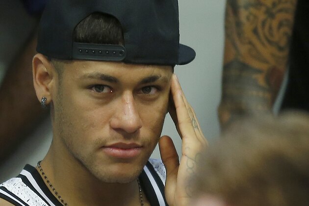 FC Barcelona's Neymar, from Brazil, left, and Lionel Messi, from Argentina, attend  the farewell press conference of Barcelona's former player Pedro Rodriguez at the Sports Center FC Barcelona Joan Gamper in San Joan Despi, Spain, Monday, Aug. 24, 2015. Rodriguez was signed by Chelsea and his arrival bolsters Mourinho's attacking options, with the highlighting the Spaniard's versatility by being able to play as a winger or center forward. (AP Photo/Manu Fernandez)