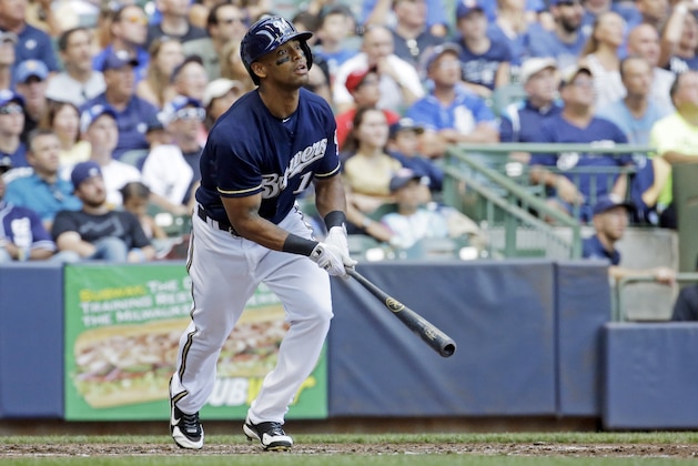 Milwaukee Brewers' Khris Davis hits a three-run home run during the third inning of a baseball game against the San Diego Padres Thursday, Aug. 6, 2015, in Milwaukee. (AP Photo/Morry Gash)