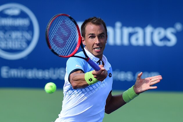 WINSTON-SALEM, NC - AUGUST 24:  Lukas Rosol of Czech Republic returns a shot from Ernests Gulbis of Latvia during the first day of the Winston-Salem Open at Wake Forest University on August 24, 2015 in Winston-Salem, North Carolina.  (Photo by Jared C. Tilton/Getty Images)