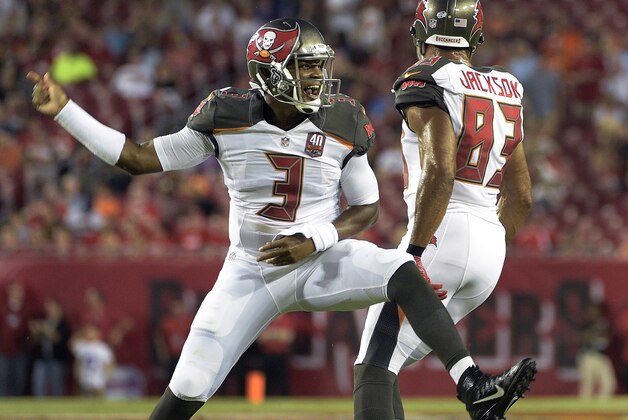 Tampa Bay Buccaneers quarterback Jameis Winston (3) celebrates with wide receiver Vincent Jackson (83) after Winston scored a touchdown against the Cincinnati Bengals during the first quarter of an NFL preseason football game Monday, Aug. 24, 2015, in Tampa, Fla. (AP Photo/Phelan M. Ebenhack)