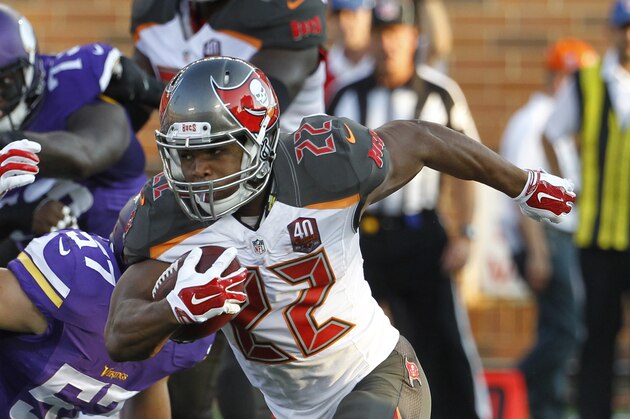 Tampa Bay Buccaneers running back Doug Martin (22) runs against the Minnesota Vikings during the first half of a preseason NFL football game at TCF Bank Stadium Saturday, Aug. 15, 2015, in Minneapolis. (AP Photo/Ann Heisenfelt)
