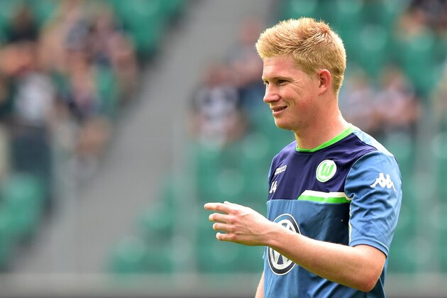 Wolfsburg's Belgian midfielder Kevin De Bruyne warms up prior to the German first division Bundesliga football match VfL Wolfsburg vs Eintracht Frankfurt in Wolfsburg, northern Germany, on August 16, 2015.  AFP PHOTO / JOHN MACDOUGALL

RESTRICTIONS: DURING MATCH TIME: DFL RULES TO LIMIT THE ONLINE USAGE TO 15 PICTURES PER MATCH AND FORBID IMAGE SEQUENCES TO SIMULATE VIDEO. 
== RESTRICTED TO EDITORIAL USE ==
FOR FURTHER QUERIES PLEASE CONTACT DFL DIRECTLY AT + 49 69 650050.        (Photo credit should read JOHN MACDOUGALL/AFP/Getty Images)