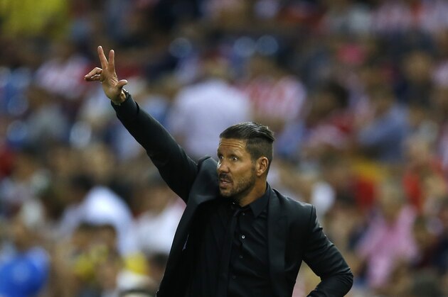 Atletico Madrid's head coach Diego Simeone gives instructions from the side line during the Spanish La Liga soccer match between Atletico Madrid and Las Palmas at the Vicente Calderon stadium in Madrid, Spain, Saturday, Aug. 22, 2015. Atletico Madrid won 1-0. (AP Photo/Francisco Seco)