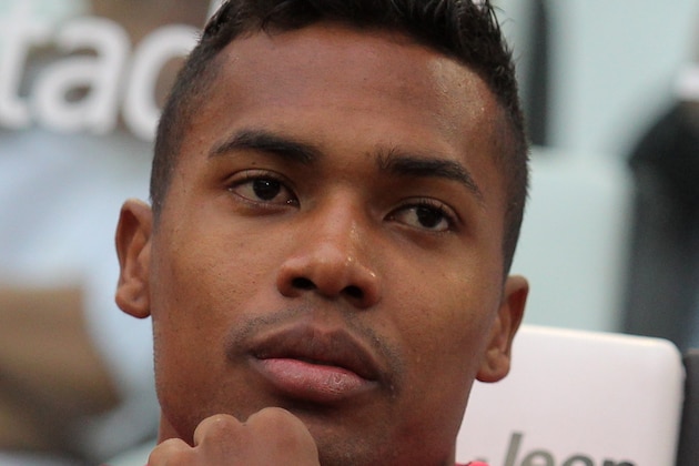Juventus' defender from Brazil, Alex Sandro, looks on before the Italian Serie A football match Juventus Vs Udinese on August 23, 2015 at the 'Juventus Stadium' in Turin.  AFP PHOTO / MARCO BERTORELLO        (Photo credit should read MARCO BERTORELLO/AFP/Getty Images)