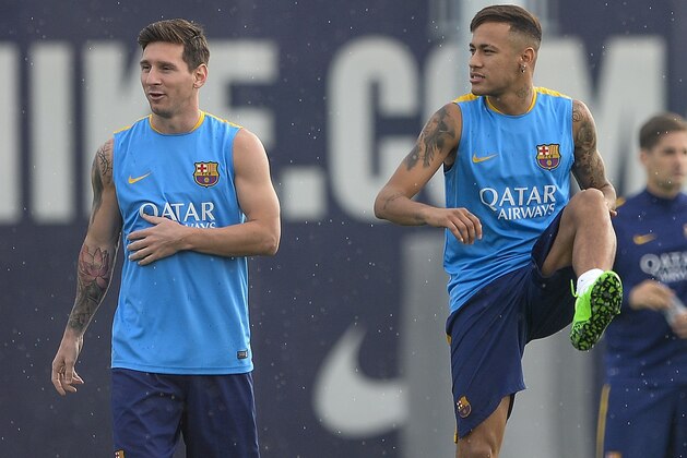 Barcelona's Argentinian forward Lionel Messi (L) and Barcelona's Brazilian forward Neymar da Silva Santos Junior take part  in a training session at the Sports Center FC Barcelona Joan Gamper in Sant Joan Despi, near Barcelona on August 22, 2015 on the eve of the first Spanish League 'La Liga'  football match against Athletic Bilbao in Bilbao. FC Barcelona have seemed invincible after its colossal triple-Liga Cup-Champions League in the spring, but the Catalan ogre addresses the defense of its Spanish title with significant gaps before facing Bilbao tomorrow for the 1st day of Liga. AFP PHOTO/ JOSEP LAGO        (Photo credit should read JOSEP LAGO/AFP/Getty Images)
