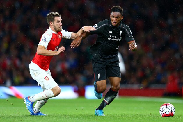 LONDON, ENGLAND - AUGUST 24:  Joe Gomez of Liverpool takes on Aaron Ramsey of Arsenal during the Barclays Premier League match between Arsenal and Liverpool at the Emirates Stadium on August 24, 2015 in London, United Kingdom.  (Photo by Clive Mason/Getty Images)