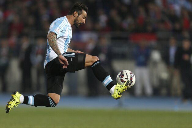 Argentina's Ezequiel Lavezzi controls the ball during the Copa America final soccer match against Chile at the National Stadium in Santiago, Chile, Saturday, July 4, 2015. (AP Photo/Luis Hidalgo)
