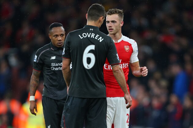 LONDON, ENGLAND - AUGUST 24:  Calum Chambers of Arsenal talks to former Southampton team mates Dejan Lovren and Nathaniel Clyne of Liverpool after the Barclays Premier League match between Arsenal and Liverpool at the Emirates Stadium on August 24, 2015 in London, United Kingdom.  (Photo by Catherine Ivill - AMA/Getty Images)