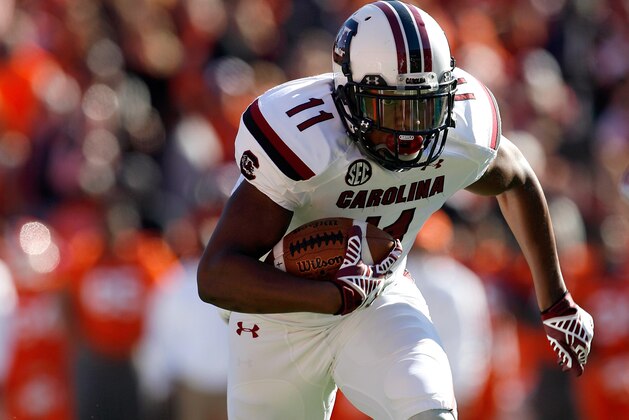 CLEMSON, SC - NOVEMBER 29: Pharoh Cooper #11 of the South Carolina Gamecocks rushes for a touchdown during their game against the Clemson Tigers at Memorial Stadium on November 29, 2014 in Clemson, South Carolina. (Photo by Tyler Smith/Getty Images)
