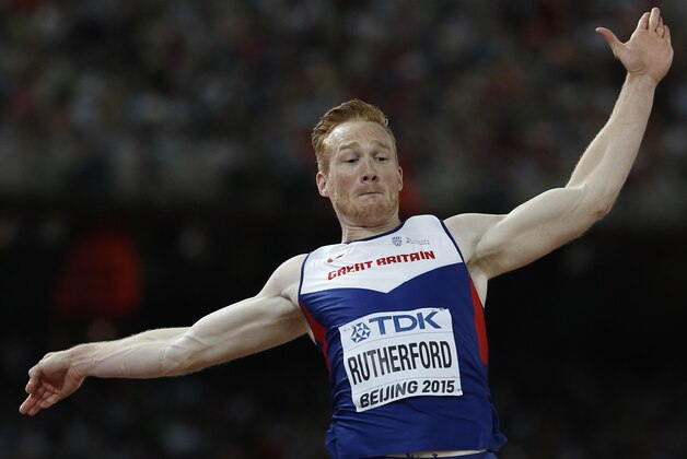 Britain's Greg Rutherford competes in the final of the men's long jump athletics event at the 2015 IAAF World Championships at the 'Bird's Nest' National Stadium in Beijing on August 25, 2015.  AFP PHOTO / ADRIAN DENNIS        (Photo credit should read ADRIAN DENNIS/AFP/Getty Images)