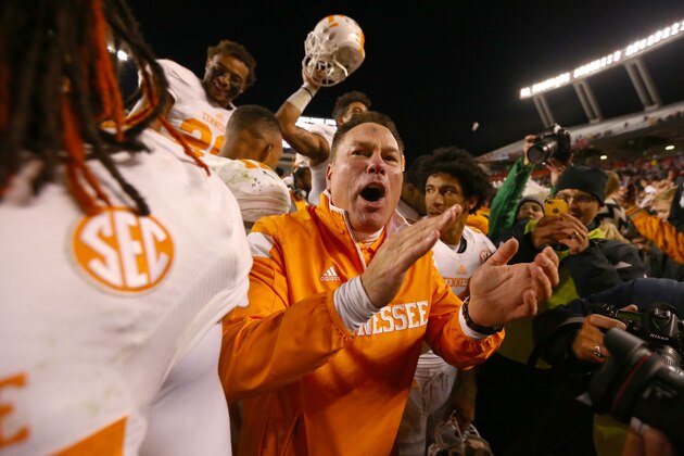 COLUMBIA, SC - NOVEMBER 01:  Head coach Butch Jones of the Tennessee Volunteers celebrates with his team after defeating the South Carolina Gamecocks 45-42 in overtime at Williams-Brice Stadium on November 1, 2014 in Columbia, South Carolina.  (Photo by Streeter Lecka/Getty Images)