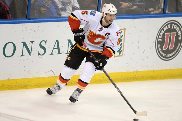 Calgary Flames' Mark Giordano (5) skates against the St. Louis Blues in a NHL hockey game, Saturday, Oct. 11, 2014, in St. Louis. (AP Photo/Bill Boyce)