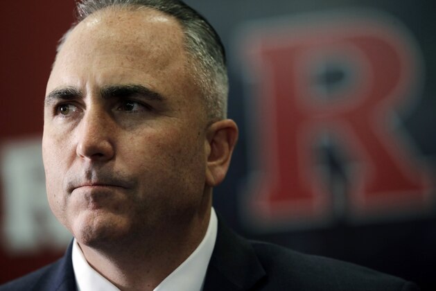 Rutgers football head coach Kyle Flood listens to a question about the Scarlet Knights' recruiting class on national signing day, Wednesday, Feb. 4, 2015, in Piscataway, N.J. (AP Photo/Mel Evans)