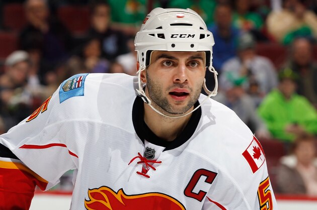 GLENDALE, AZ - MARCH 15: Mark Giordano #5 of the Calgary Flames skates against the Phoenix Coyotes at the Jobing.com Arena on March 15, 2014 in Glendale, Arizona. The Coyotes defeated the Flames 3-2.  (Photo by Bruce Bennett/Getty Images)