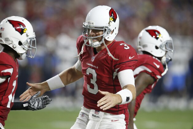 Arizona Cardinals quarterback Carson Palmer (3) celebrates his touchdown pass to teammate John Brown (12) during the first half of an NFL preseason football game, Saturday, Aug. 22, 2015, in Glendale, Ariz. (AP Photo/Rick Scuteri)