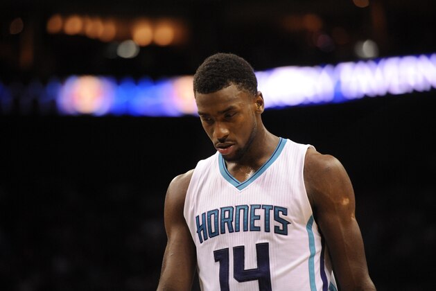 Mar 25, 2015; Charlotte, NC, USA; Charlotte Hornets forward Michael Kidd-Gilchrist (14) in a time out during the second half of the game against the Brooklyn Nets at Time Warner Cable Arena. Nets win 91-88. Mandatory Credit: Sam Sharpe-USA TODAY Sports