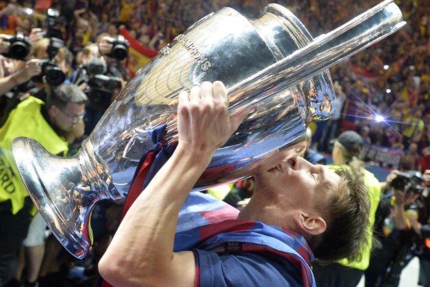Barcelona's Lionel Messi kisses the trophy after winning 3-1 the Champions League final soccer match between Juventus Turin and FC Barcelona at the Olympic stadium in Berlin Saturday, June 6, 2015. (AP Photo/Martin Meissner)