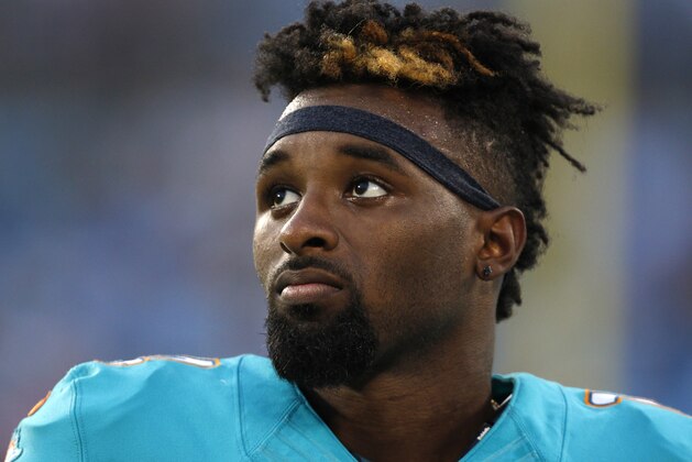 Miami Dolphins' Jarvis Landry (14) watches from the sidelines during the first half of an NFL preseason football game against the Carolina Panthers in Charlotte, N.C., Saturday, Aug. 22, 2015. (AP Photo/Bob Leverone)