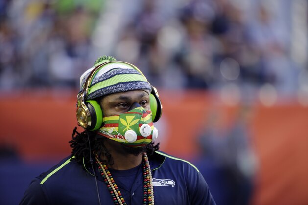 Seattle Seahawks running back Marshawn Lynch warms up before the NFL Super Bowl XLIX football game against the New England Patriots Sunday, Feb. 1, 2015, in Glendale, Ariz. (AP Photo/David Goldman)