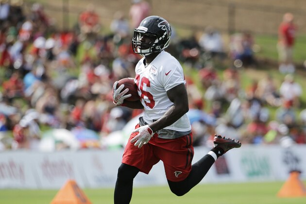 Atlanta Falcons' Tevin Coleman runs the ball during NFL football training camp Saturday, Aug. 1, 2015, in Flowery Branch, Ga. (AP Photo/David Goldman)