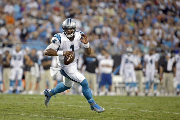 Carolina Panthers' Cam Newton (1) scrambles against the Miami Dolphins during the first half of an NFL preseason football game Saturday, Aug. 22, 2015, in Charlotte, N.C. The Panthers won 31-30. (AP Photo/Bob Leverone)