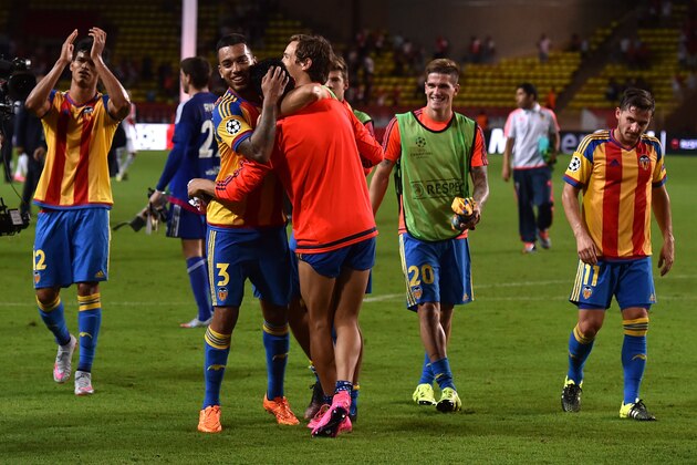MONACO - AUGUST 25:  Players of Valencia celebrate victory at the end of the UEFA Champions League qualifying round play off second leg match between Monaco and Valencia on August 25, 2015 in Monaco, Monaco.  (Photo by Valerio Pennicino/Getty Images)