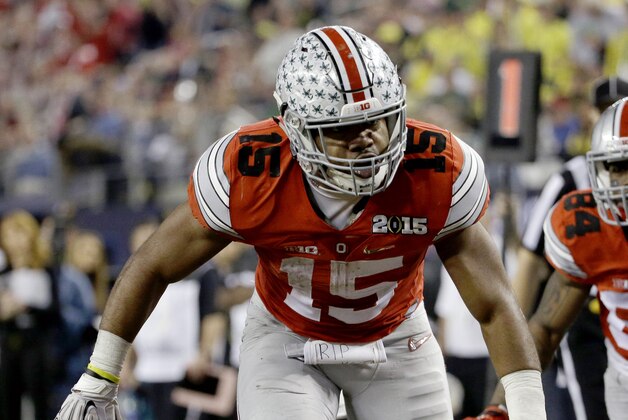 Ohio State's Ezekiel Elliott (15) celebrates after a nine-yard touchdown run during the second half of the NCAA college football playoff championship game against Oregon Monday, Jan. 12, 2015, in Arlington, Texas. (AP Photo/David J. Phillip)