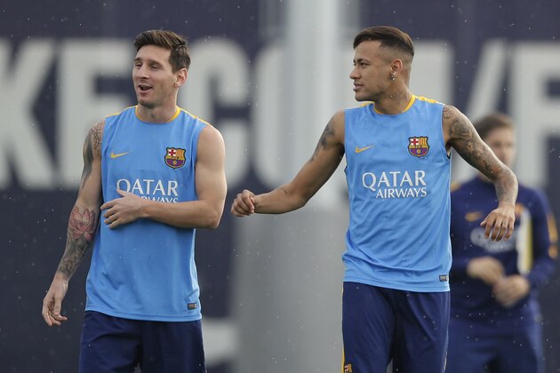 FC Barcelona's Lionel Messi, from Argentina, left, and Neymar, from Brazil, attend a training session at the Sports Center FC Barcelona Joan Gamper in San Joan Despi, Spain, Saturday, Aug. 22, 2015. (AP Photo/Manu Fernandez)
