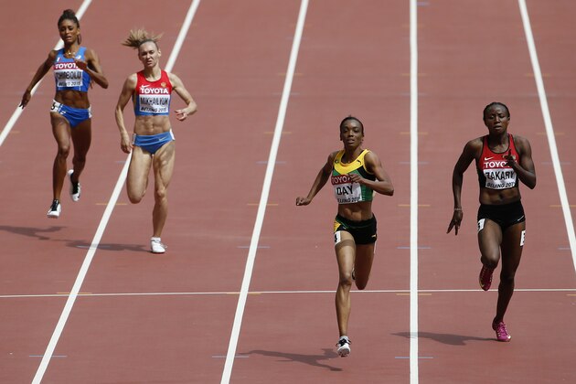 Jamaica's Christine Day, second right, races alongside Kenya's Joyce Zakary, right, in round one of the women's 400m at the World Athletics Championships at the Bird's Nest stadium in Beijing, Monday, Aug. 24, 2015. (AP Photo/Ng Han Guan)