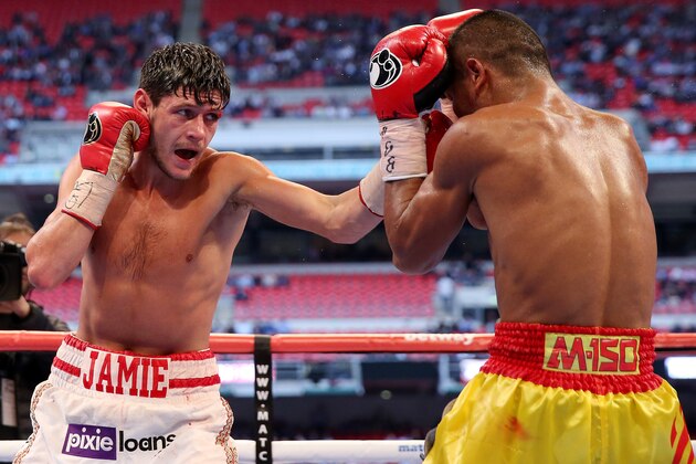 LONDON, ENGLAND - MAY 31:  Jamie McDonnell in action with Tabtimdaeng Na Rachawat during their Vacant WBA World Bantamweight Championship bout at Wembley Stadium on May 31, 2014 in London, England.  (Photo by Scott Heavey/Getty Images)