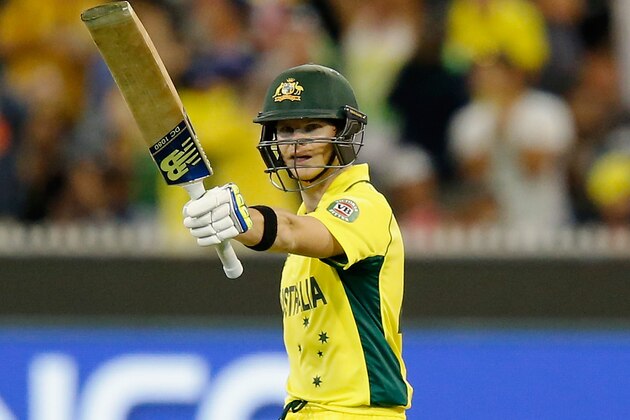 MELBOURNE, AUSTRALIA - MARCH 29:  Steve Smith of Australia raises his bat after scoring 50 runs during the 2015 ICC Cricket World Cup final match between Australia and New Zealand at Melbourne Cricket Ground on March 29, 2015 in Melbourne, Australia.  (Photo by Darrian Traynor/Getty Images)