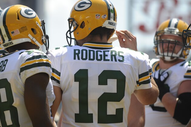 Green Bay Packers quarterback Aaron Rodgers (12) in the huddle during the NFL pre-season football game against the Pittsburgh Steelers, Sunday, Aug. 23, 2015 in Pittsburgh. (AP Photo/Vincent Pugliese)