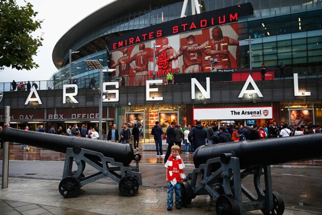 LONDON, ENGLAND - AUGUST 24: A young Arsenal fan poses outside the ground during the Barclays Premier League match between Arsenal and Liverpool at Emirates Stadium on August 24, 2015 in London, England.  (Photo by Julian Finney/Getty Images)